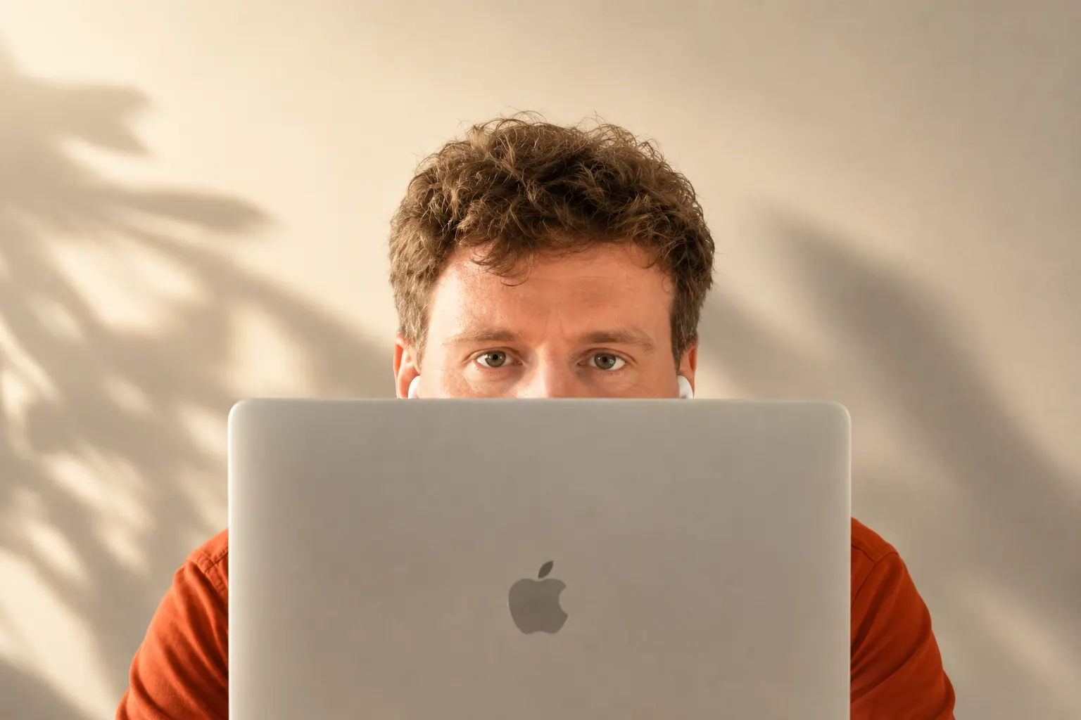 Christopher Alan Jones behind a laptop